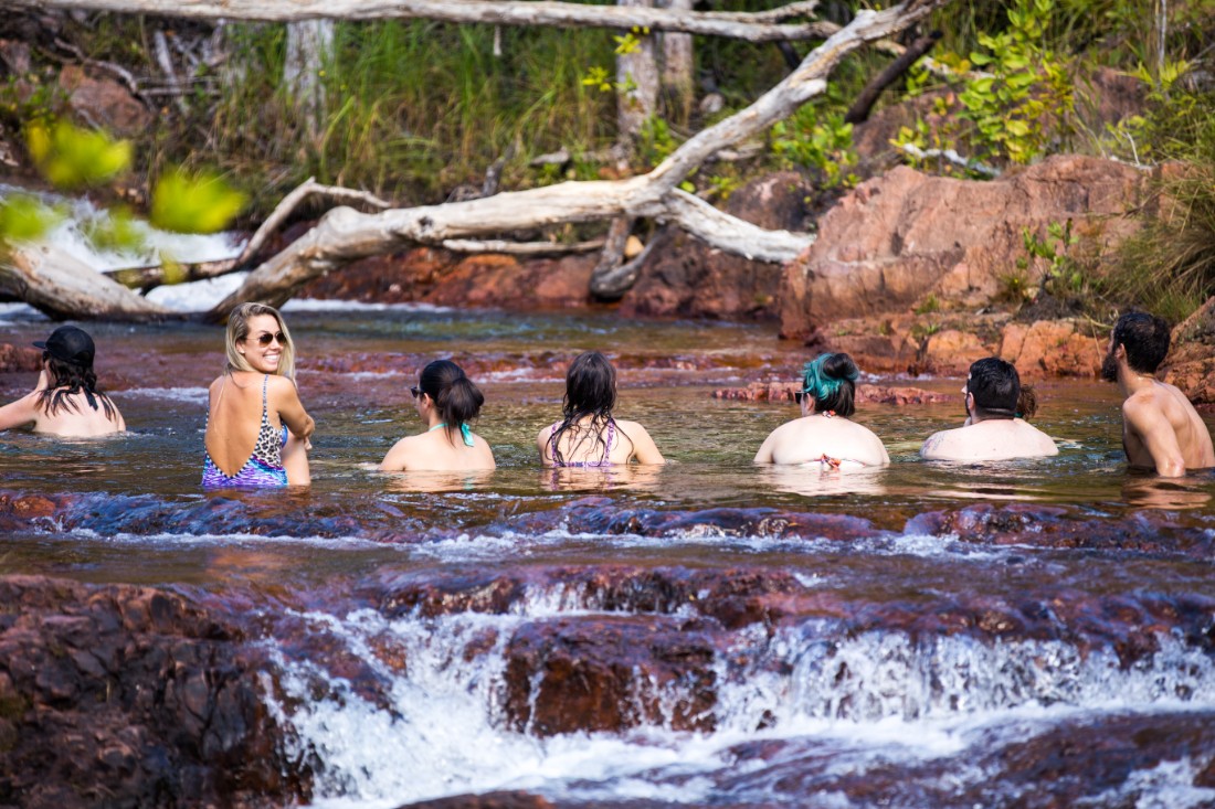 Travellers in a waterhole in the Top End