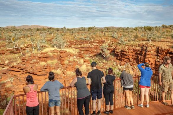 A group of travellers overlooking the gorges in Karijini National Park